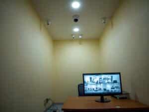 A realistic indoor photo of a small Pakistani office or shop in Lahore