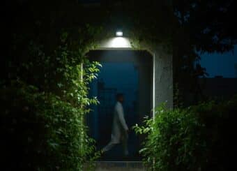 Motion sensor light installed above the backyard of a Pakistani home,