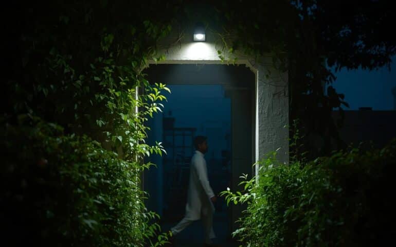 Motion sensor light installed above the backyard of a Pakistani home,